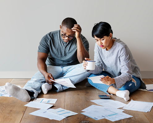 couple on the floor with papers