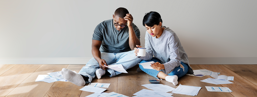 couple on the floor with papers